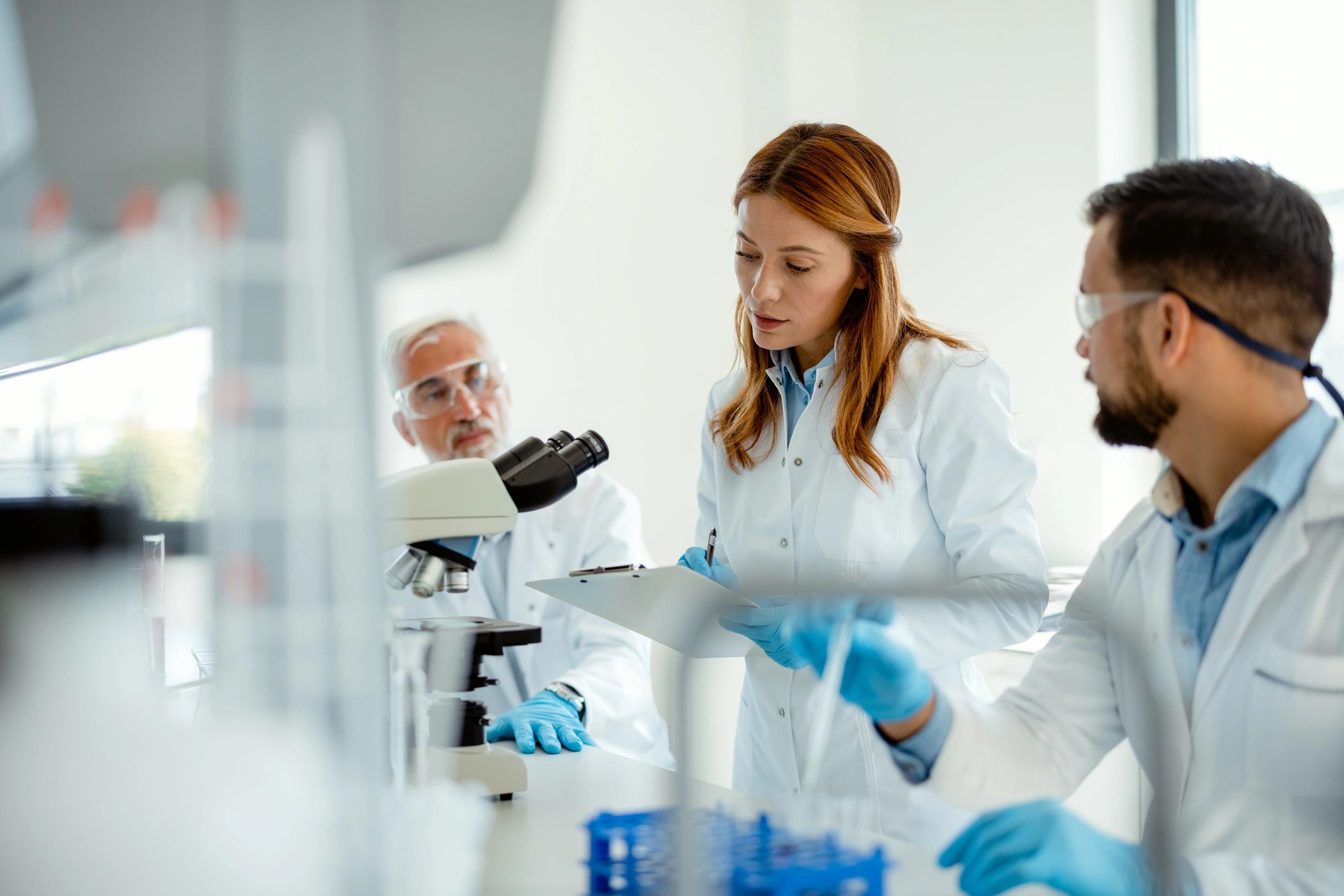 Team of scientists collaborating in a modern laboratory